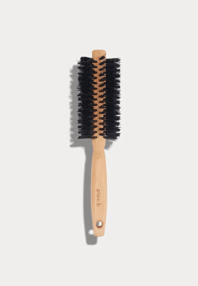 Round brush for your hair styling with natural bristles made of wood and bristle cushion made of natural rubber, sustainable round brush